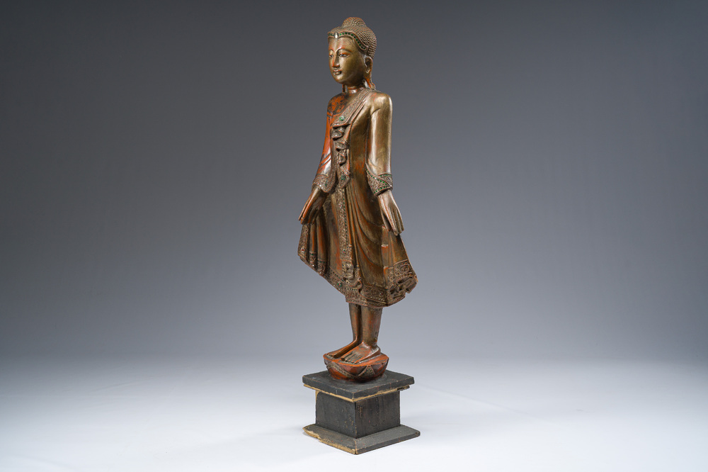 A tall Thai inlaid gilt lacquered wooden figure of a standing Buddha, 20th C.
