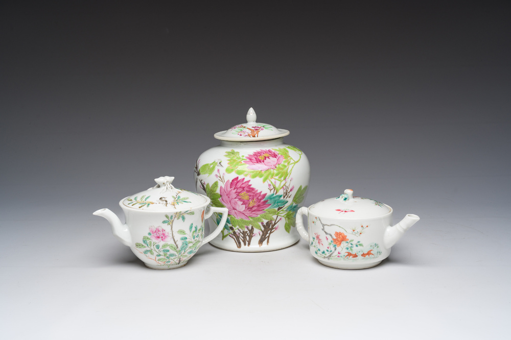 Two Chinese famille rose teapots and covers and a qianjiang cai jar and cover with floral design, 19th/20th C.