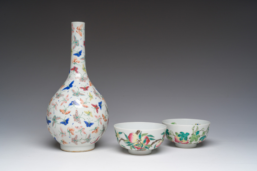 A Chinese famille rose '100 butterflies' vase and two bowls with peaches and balsam pears, Qianlong mark, 20th C.