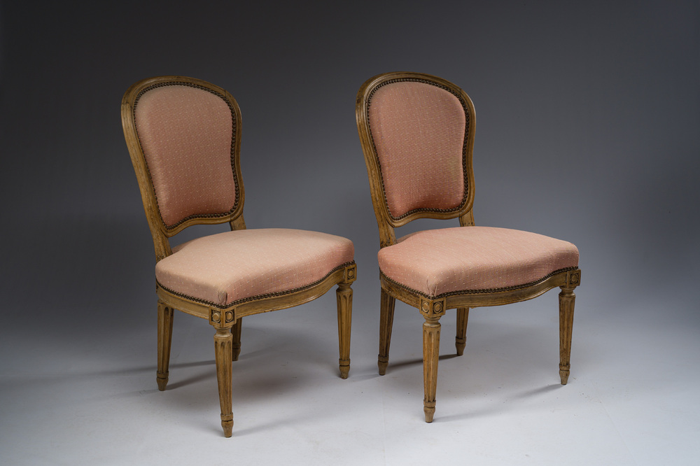 A pair of French Transition carved beechwooden chairs with old pink upholstery, 18th C.