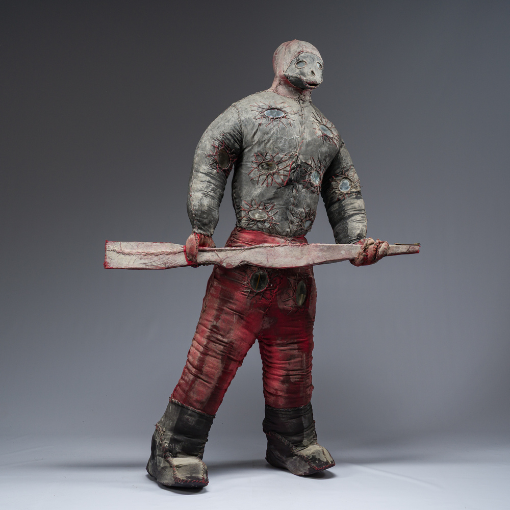 A Haitian Bizango statue of a male warrior with a firearm in his hand, mixed media, 20th century