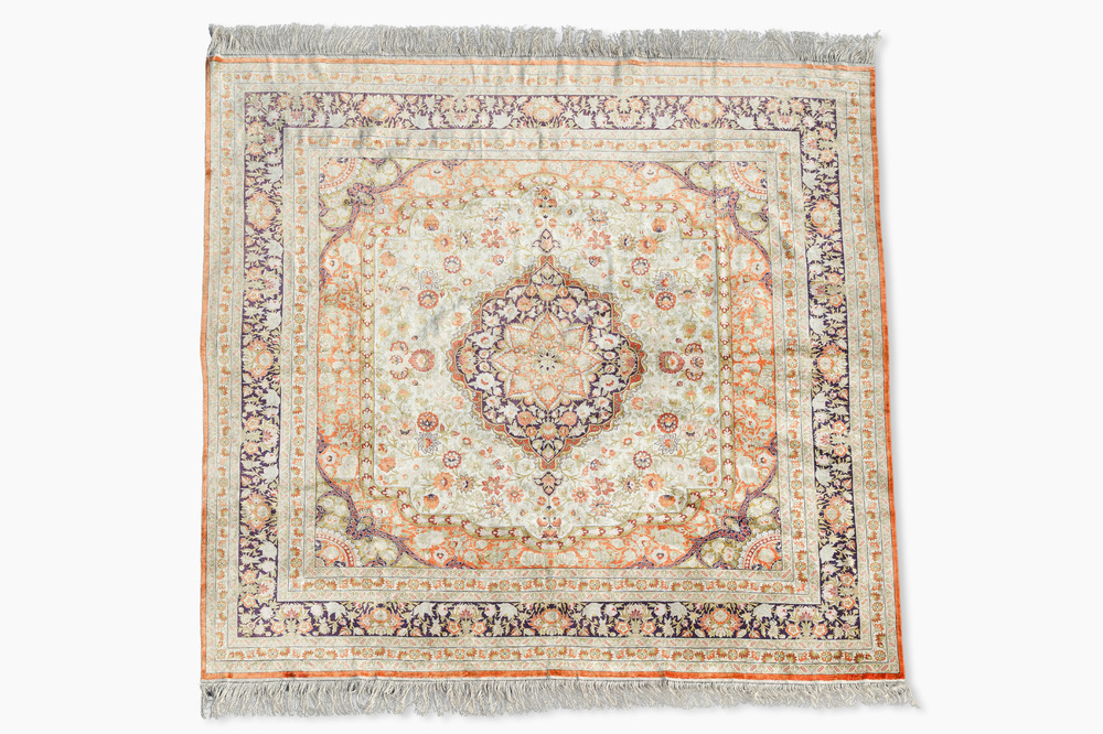 A Chinese silk Hereke style rug with floral design, 20th C.