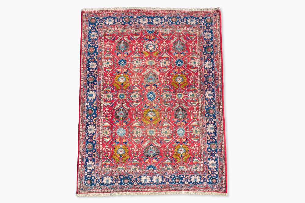 A Persian Varamin rug with floral design, wool on cotton, 20th C.