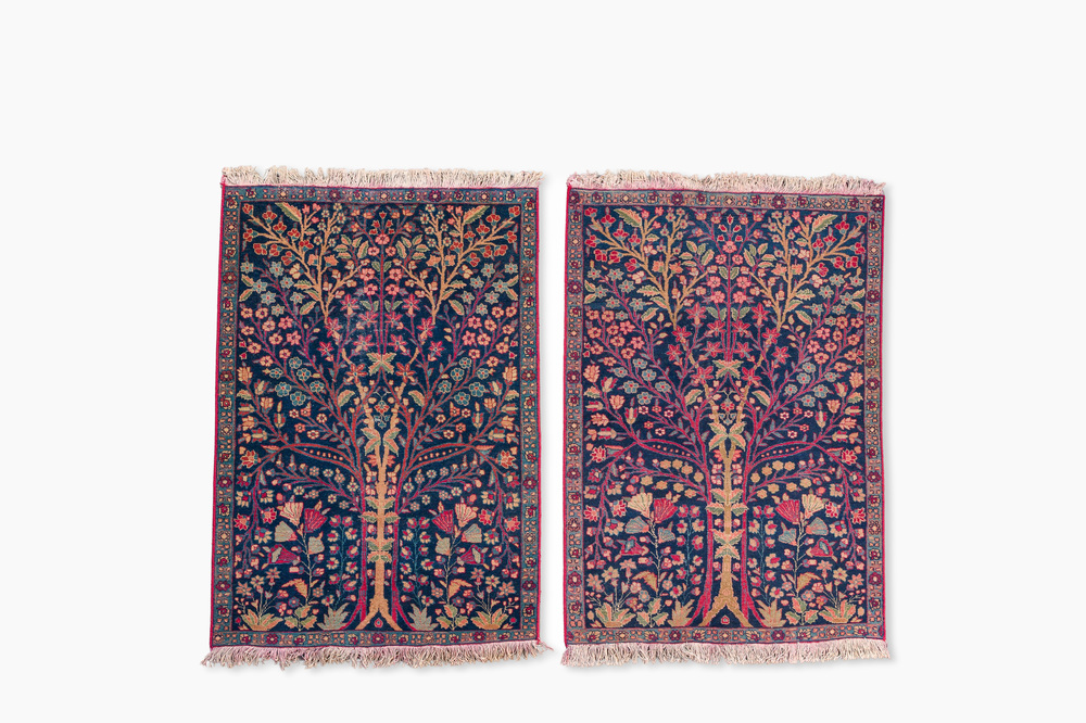 A pair of Persian Kerman (Kirman) rugs with floral design, wool on cotton, 20th C.