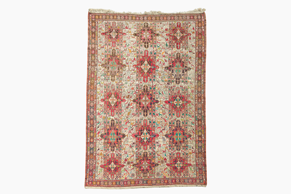 A Persian or Russian Soumak (Sumakh) rug with geometric flowers and animals, silk on wool, 20th C.