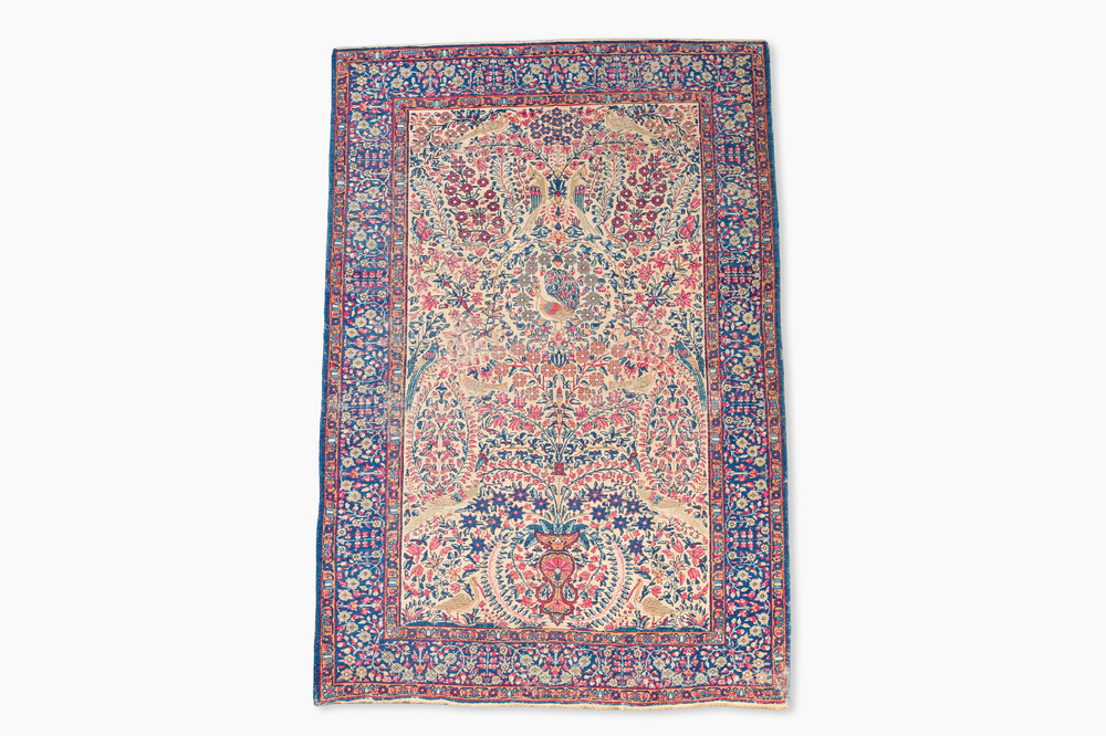 A Persian Kerman (Kirman) rug with floral design, wool on cotton, first half 20th C.
