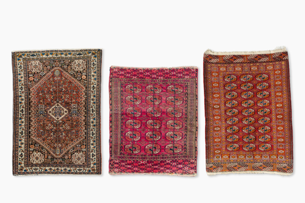 Two Persian and one Afghan rug with geometric design, wool on cotton, 20th C.