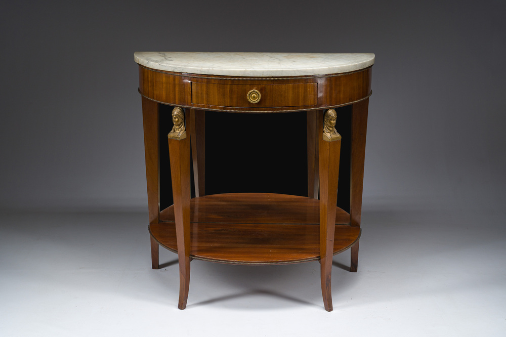 Georges Jacob (1739&ndash;1814): Console Empire demi-lune en acajou et bronze dor&eacute; ouvrant par un tiroir et surmont&eacute;e d'une tablette en marbre blanc