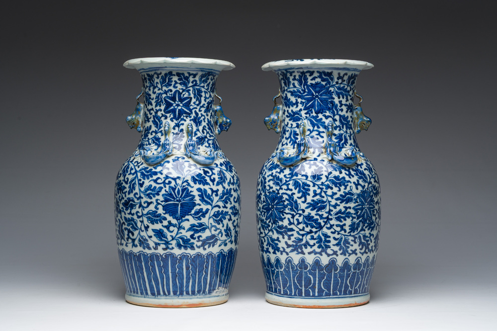 Twee Chinese blauw-witte vazen met lotusslingers en reli&euml;fdecor, 19de eeuw