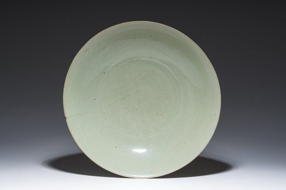 A Chinese Longquan celadon dish with incised floral design, Ming