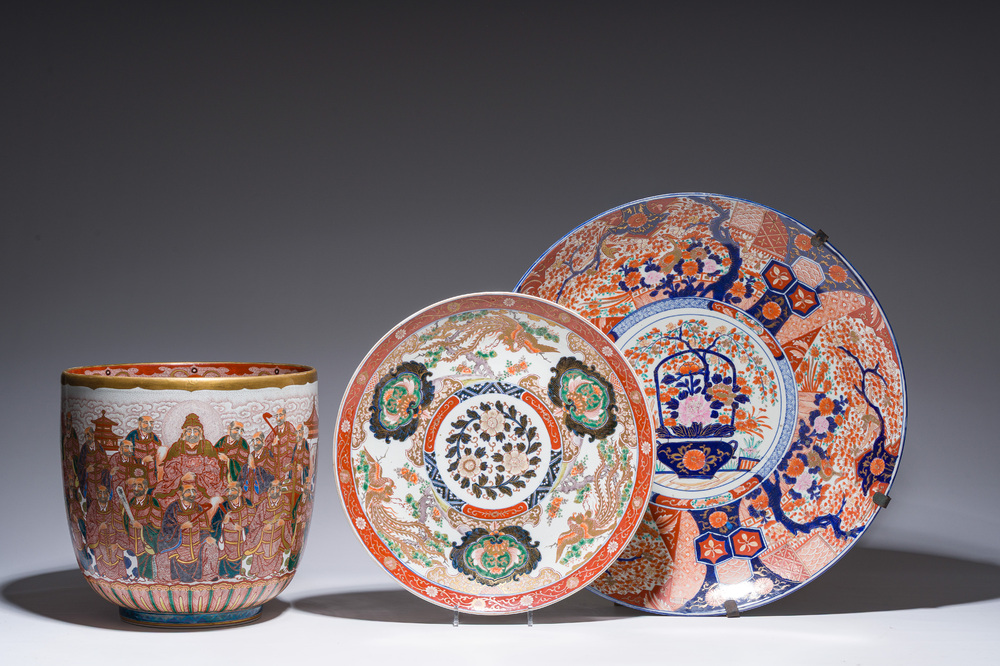 Two Japanese Imari 'fauna and flora' dishes and a ko-Kutani style 'one hundred faces' jardini&egrave;re, marked Kutani Akiyama, Meiji, 19th/20th C.