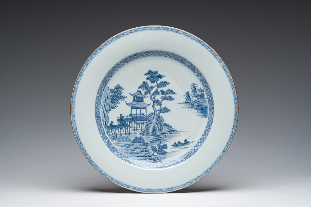 A Chinese blue and white dish with an animated river landscape, Qianlong