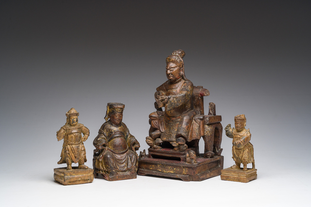 Four Chinese partially gilt and lacquered wooden 'Immortals' figures, a.o. Guandi, Qing