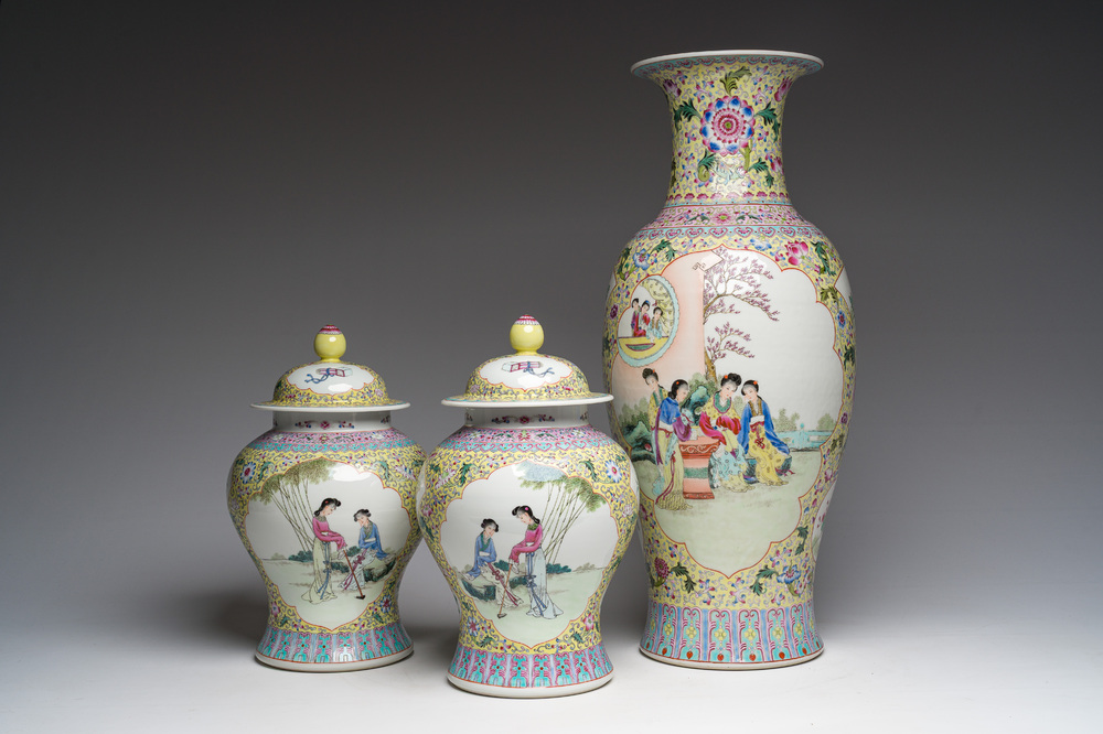 A Chinese famille rose yellow-ground baluster vase and a pair of vases and covers with animated scenes, Qianlong marks, Republic, 20th C.