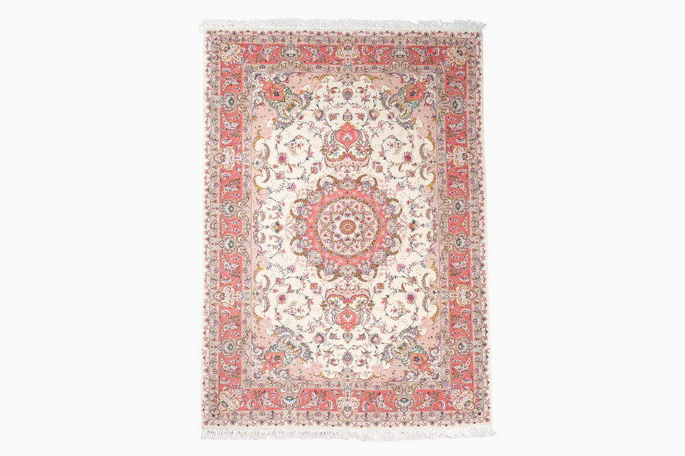 A Chinese Tabriz style rug with floral design, wool on silk, 20th C.