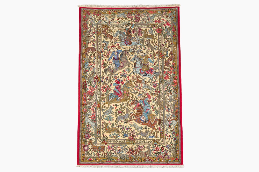 A Persian Qom (Qum/Ghom) rug with a hunting scene, signed Beheshti, wool on cotton, 20th C.