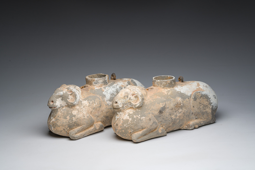 A pair of Chinese polychrome painted pottery ram-shaped vessels, Han dynasty