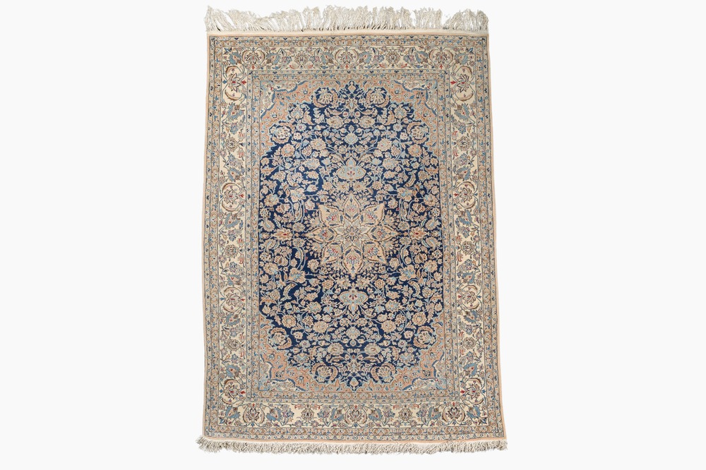 A Persian Nain rug with floral design, wool on cotton, 20th C.