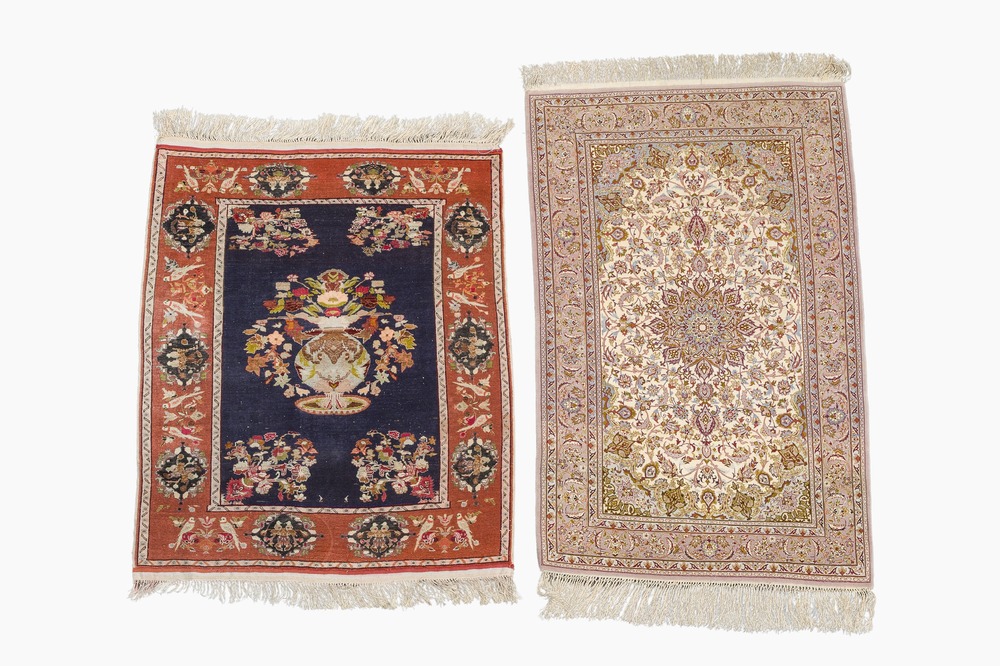 A Persian Isfahan rug and a Turkmen rug with floral design, wool, cotton and silk, 20th C.