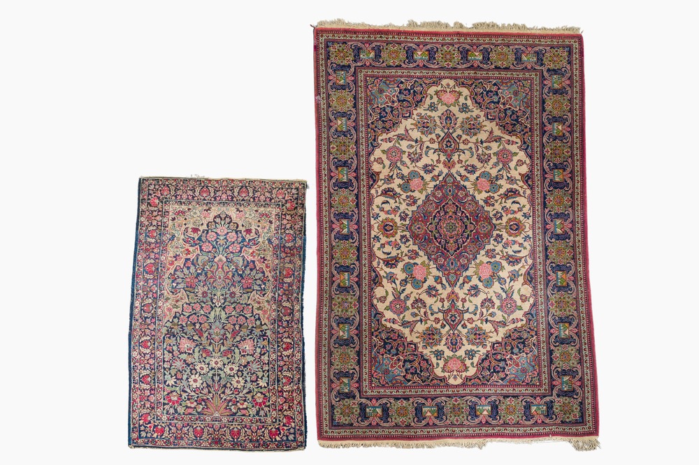 Two Persian rugs with floral design, Kashan and Kerman (Kirman), wool on cotton, 20th C.