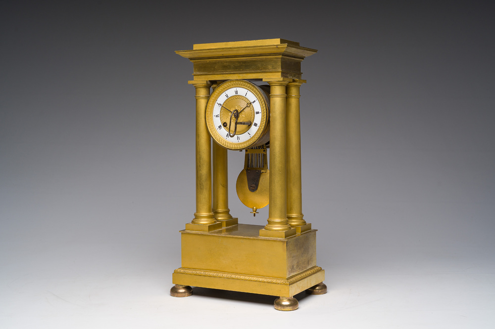 A French gilt bronze portico clock, 19th C.