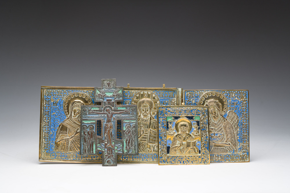 Two Russian orthodox partly enamelled bronze travel icons and an icon cross, 19th/20th C.