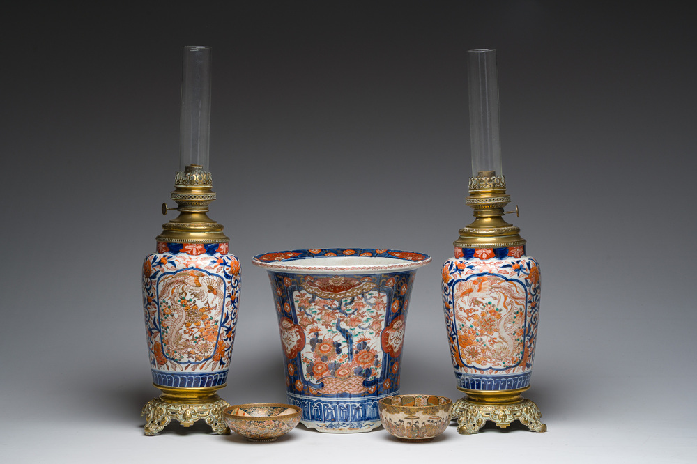 Two Japanese Satsuma bowls with animated scenes, an Imari jardini&egrave;re with floral design and two vases mounted into lamps, Meiji, 19th/20th C.