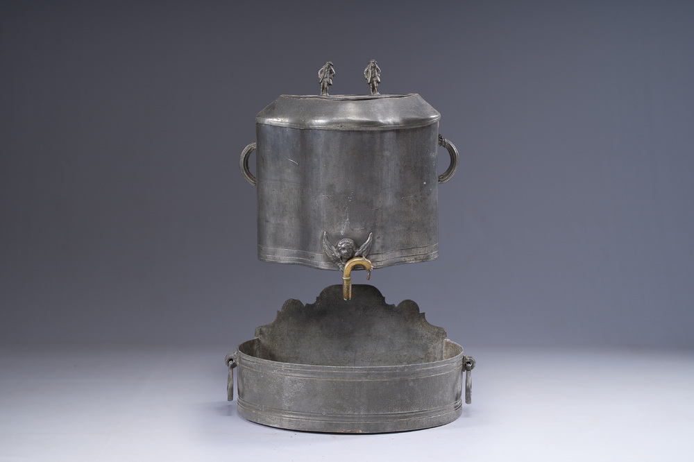 A German pewter water fountain crowned with two figures, late 17th C.