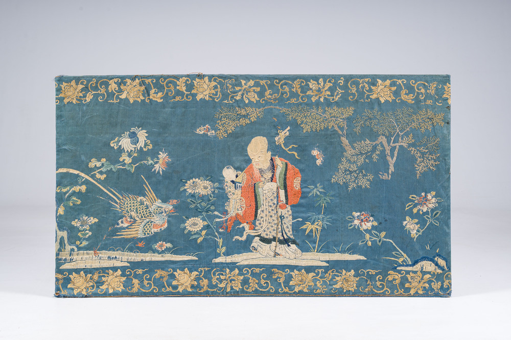 A Chinese horizontal silk embroidery with the 'Star God' Shou Xing and his servant in a landscape, 19th C.