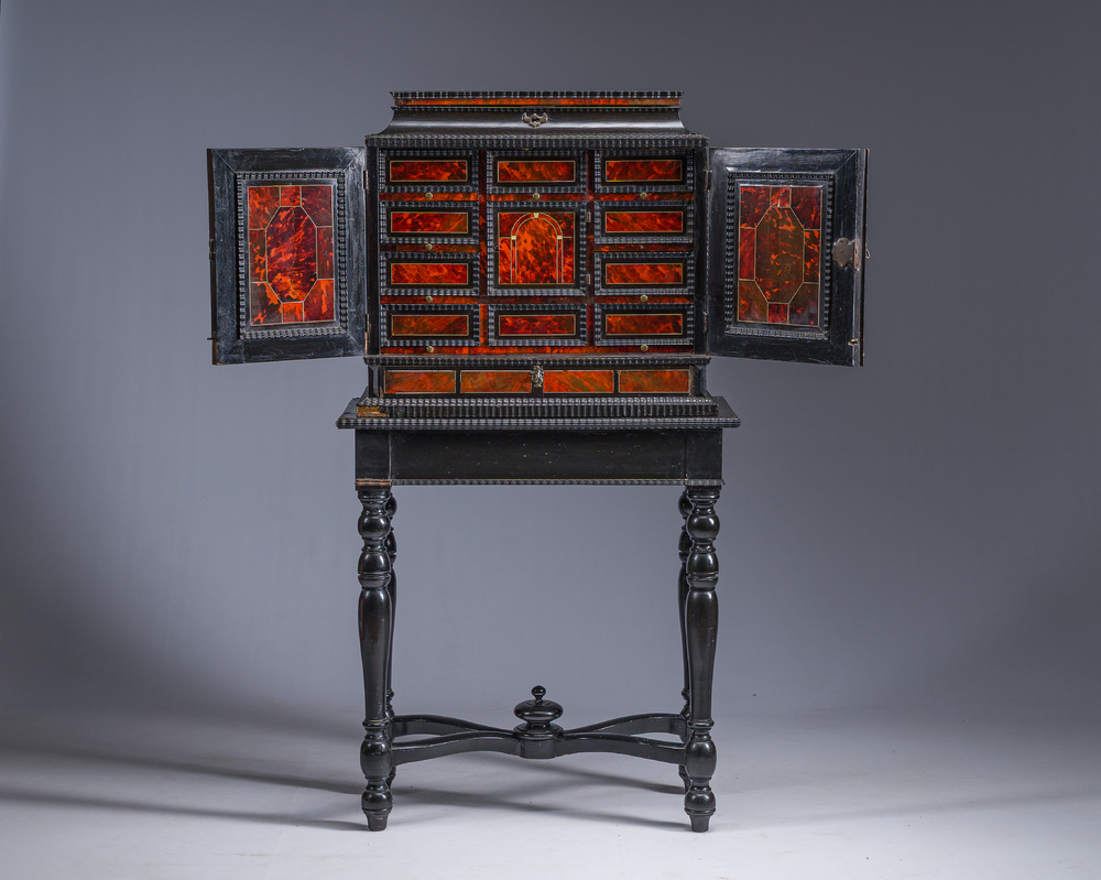 An ebonized wooden and tortoiseshell-veneered Antwerp cabinet on stand, 17th C. and later