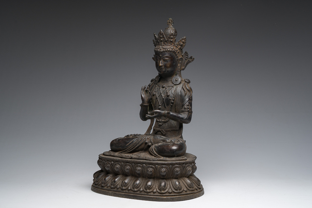 A Sino-Tibetan patinated bronze figure of Buddha, 20th C.