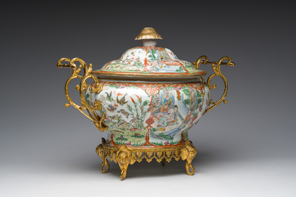 A Chinese Canton famille rose gilt mounted tureen and cover with animated scenes resting on four elephant heads, 19th C.