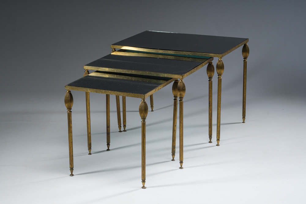 Three French Maison Jansen style brass nesting tables with fluted legs and mirrored glass tops, 1960s
