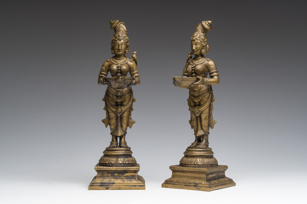 A pair of Indian oil lamps in the shape of Deepalakshmi with a bowl in her hands, 20th C.