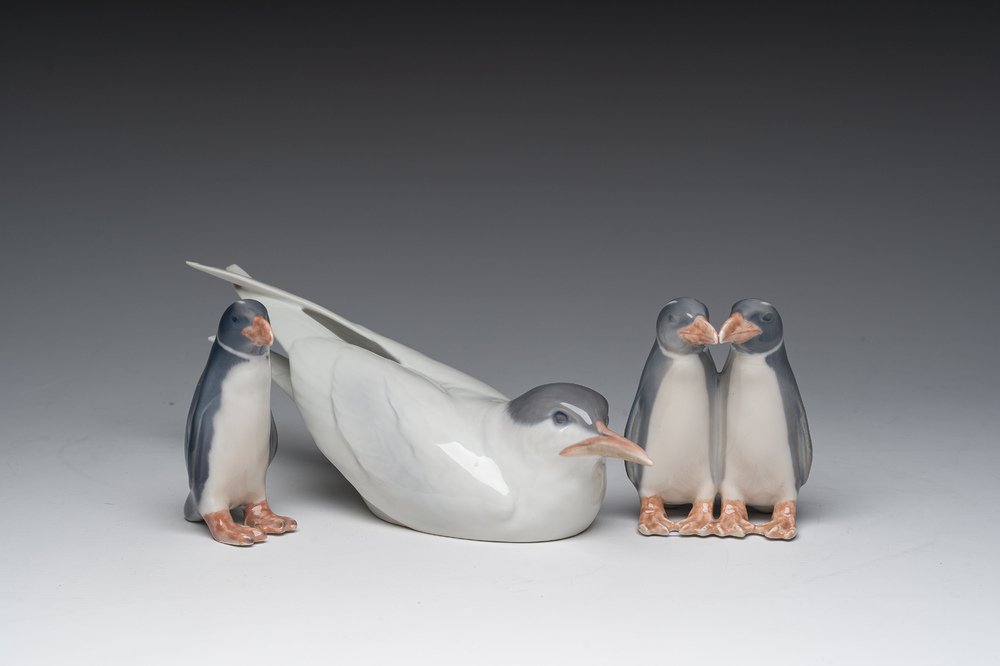Three Danish Royal Copenhagen polychrome decorated porcelain models of an Arctic tern and penguins, 20th C.