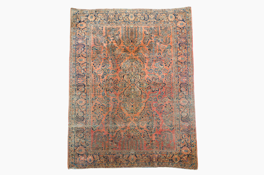 A Persian American Sarouk rug with floral design, wool on cotton, 20th C.