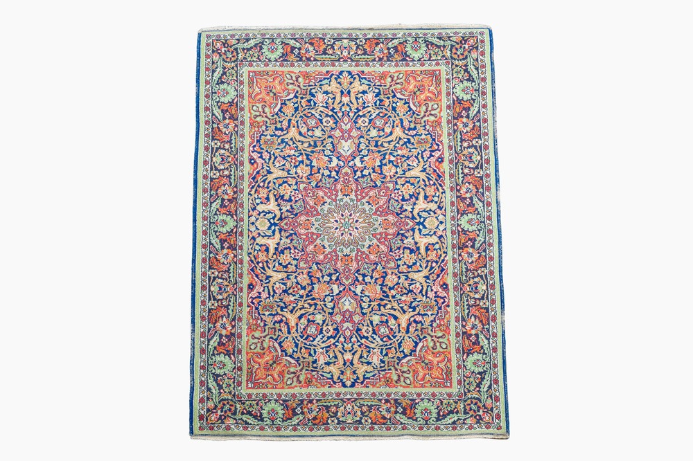 A Persian Sarouk rug with floral design, wool on cotton, 20th C.