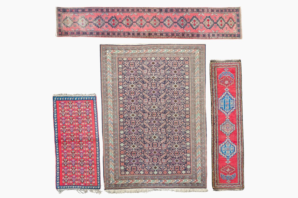 Four oriental rugs, a.o. a Persian Shirvan rug and an Azerbaijani runner with geometric design, wool on cotton, 20th C.