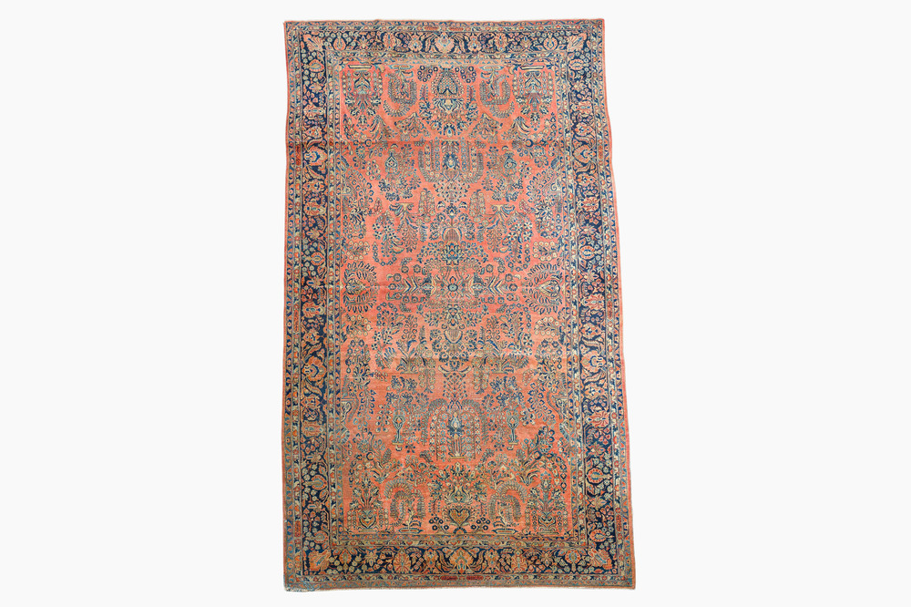 A Persian Sarouk rug with floral design, wool on cotton, first half 20th C.