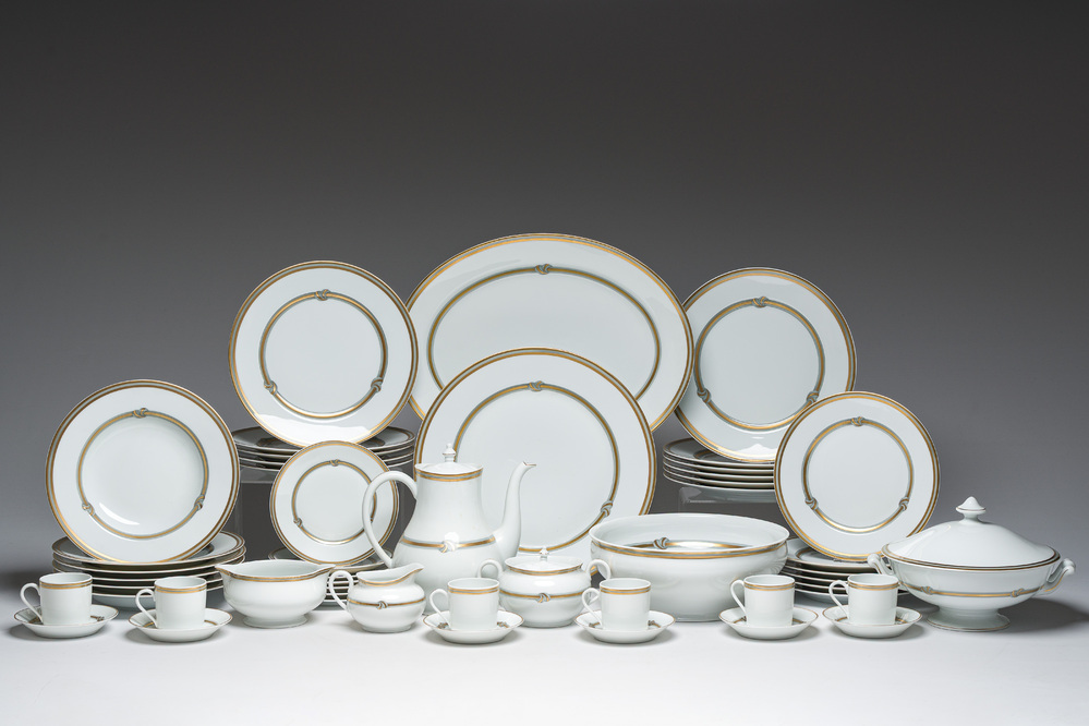 A French 50-piece polychrome and gilt porcelain 'Ruban or' service, Christofle, 20th C.