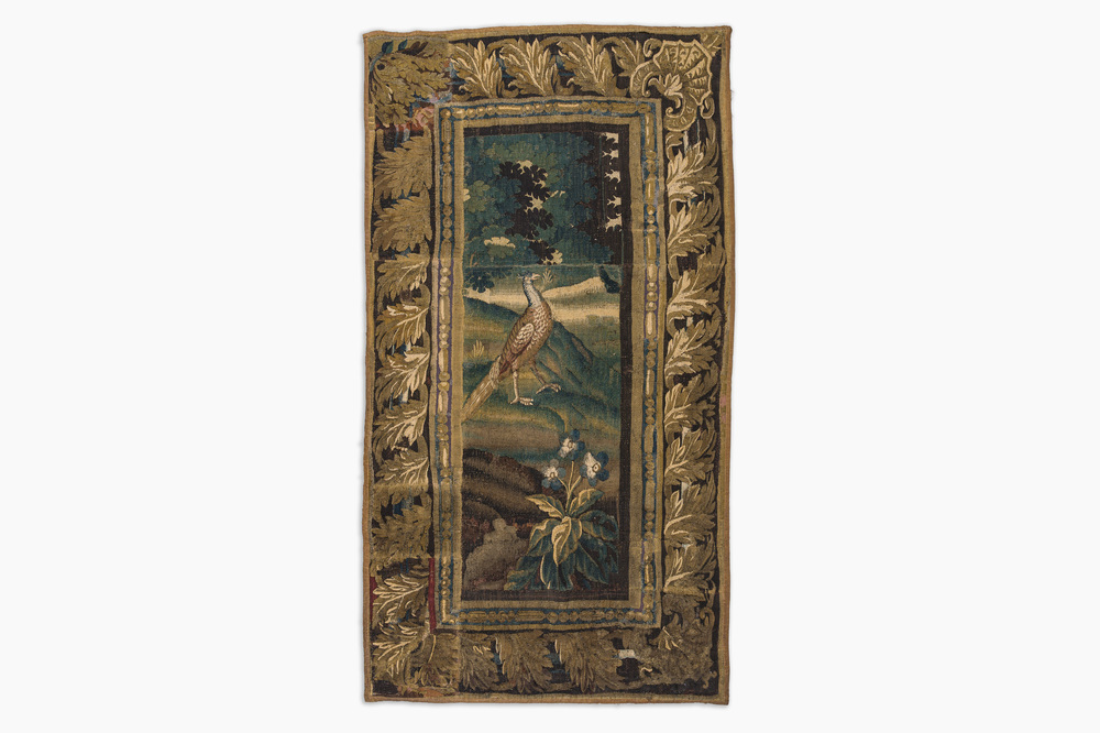 A Flemish wall tapestry with a pheasant in a landscape, 17th C.