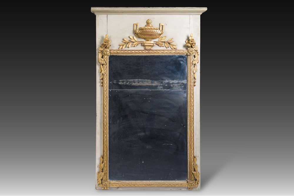 A French Louis XVI patinated and gilt wooden trumeau mirror, second half 18th C.