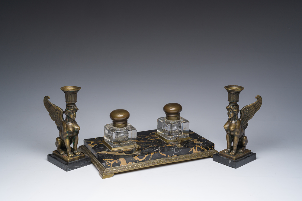 Milo (1955): A pair of bronze 'Retour d'Egypte' candlesticks and a bronze mounted marble ink stand, 19th/20th C.