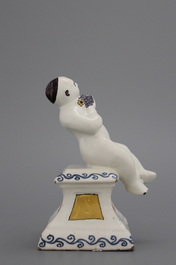 A French ceramic figure of a boy on a base, 18th C.