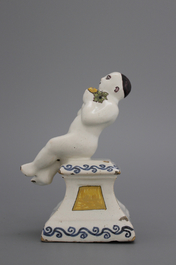 A French ceramic figure of a boy on a base, 18th C.