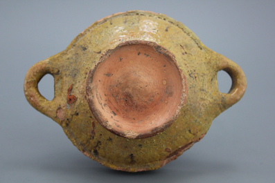 A Dutch slipware decorated porringer with a figure, dated 1608