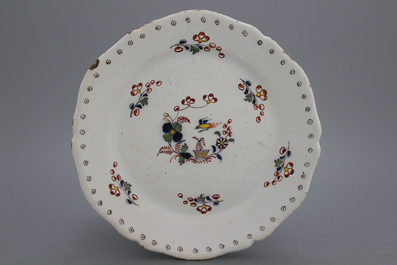 A Brussels faience lobed "floral hedge" plate, 18th C.