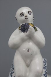 A French ceramic figure of a boy on a base, 18th C.