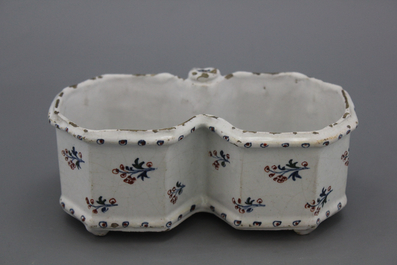 A Brussels faience "floral hedge" cruet stand, 18th C.