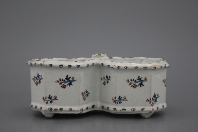 A Brussels faience "floral hedge" cruet stand, 18th C.